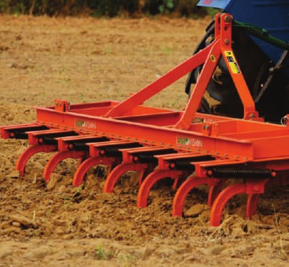 Spring tine cultivator working the soil